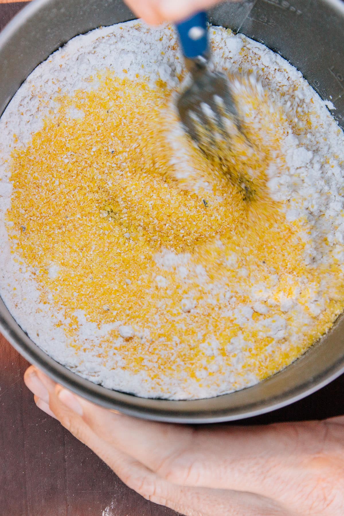 Michael mixing dry ingredients for cornbread