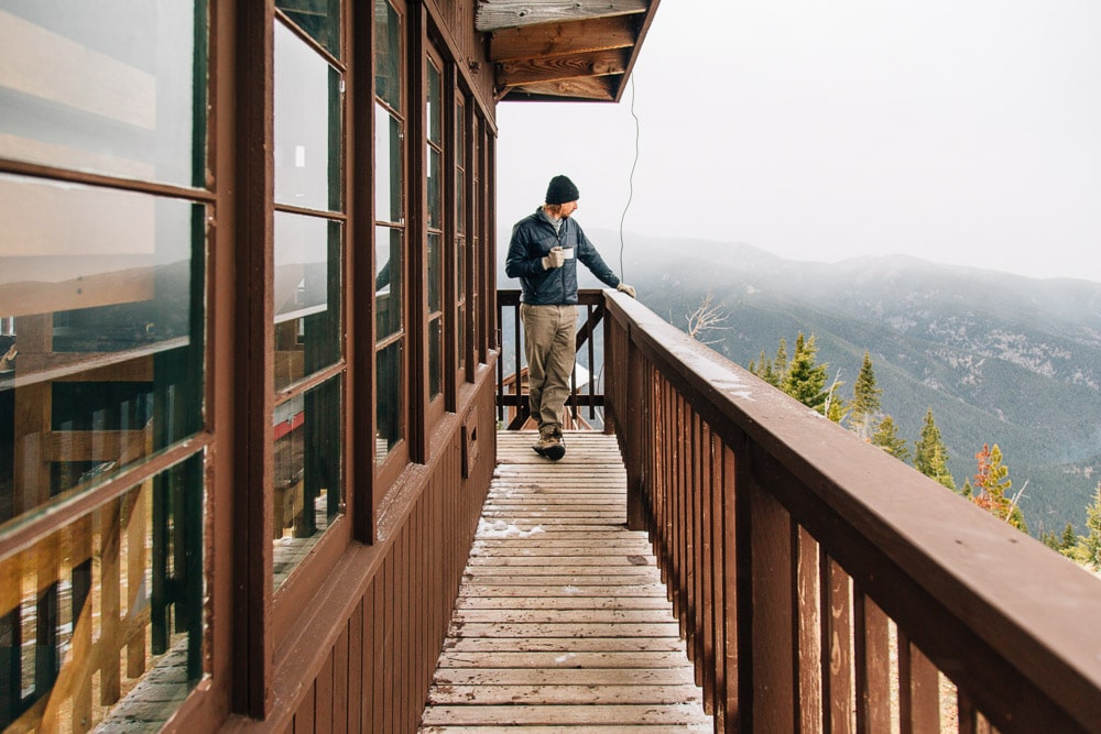 Michael standing on the deck of the Garnet mountain fire lookout tower