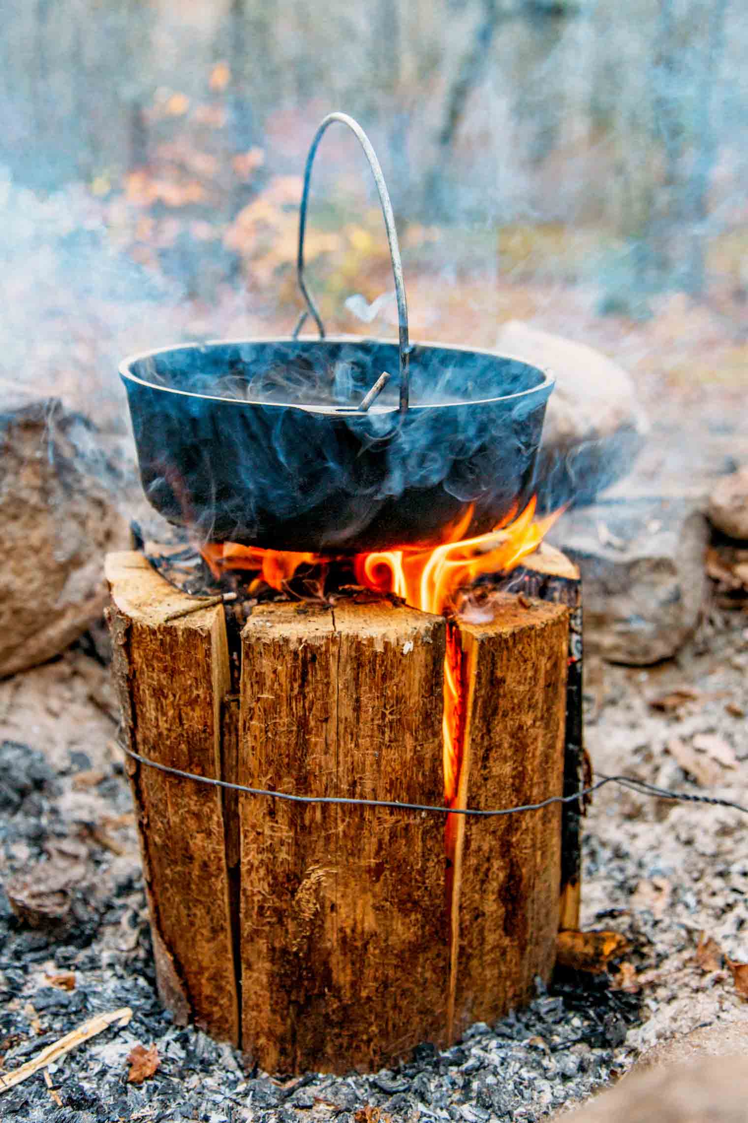 A Dutch oven sitting on the top of a Swedish firelog