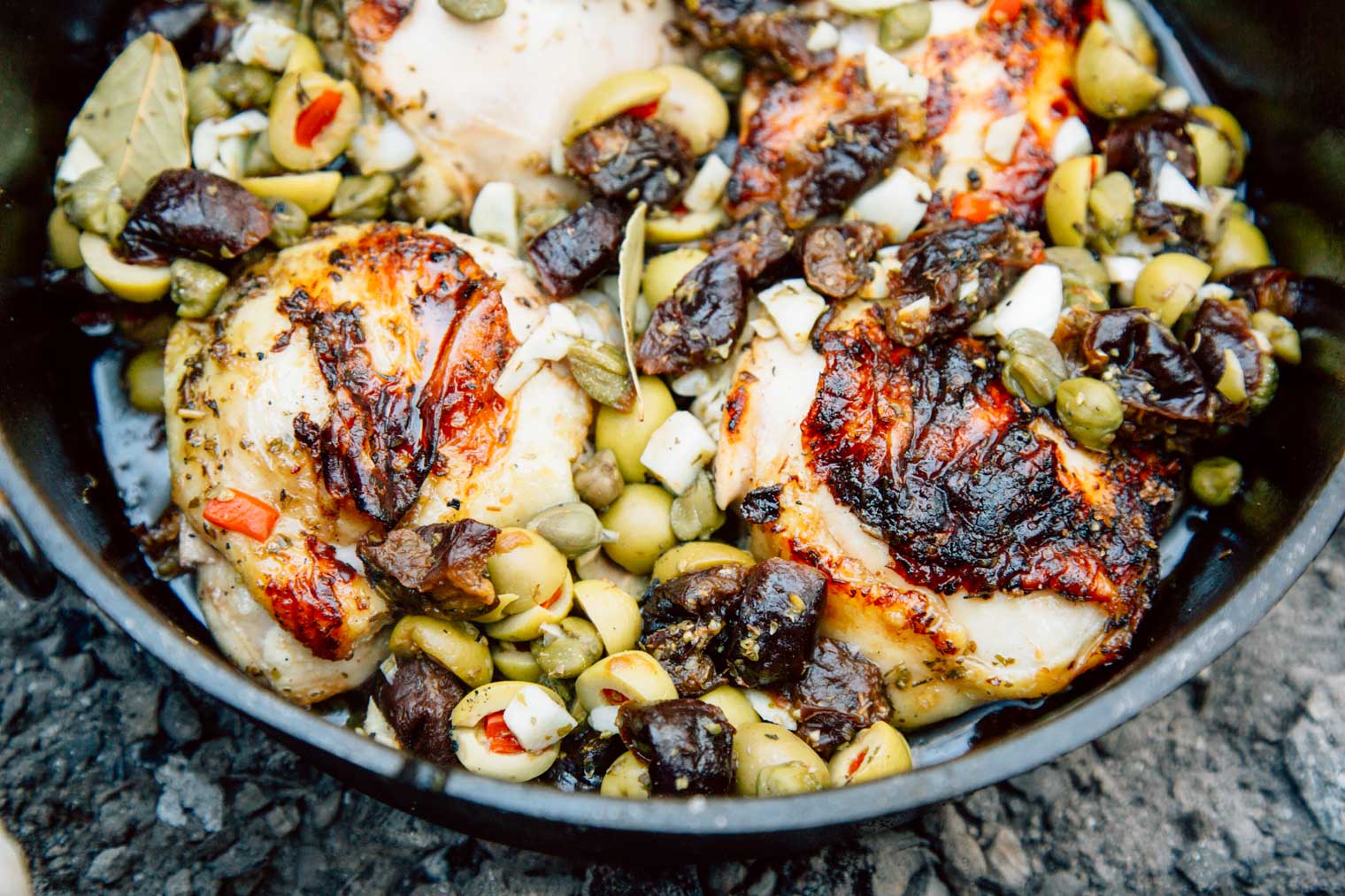 Pieces of chicken Marbella in a Dutch oven
