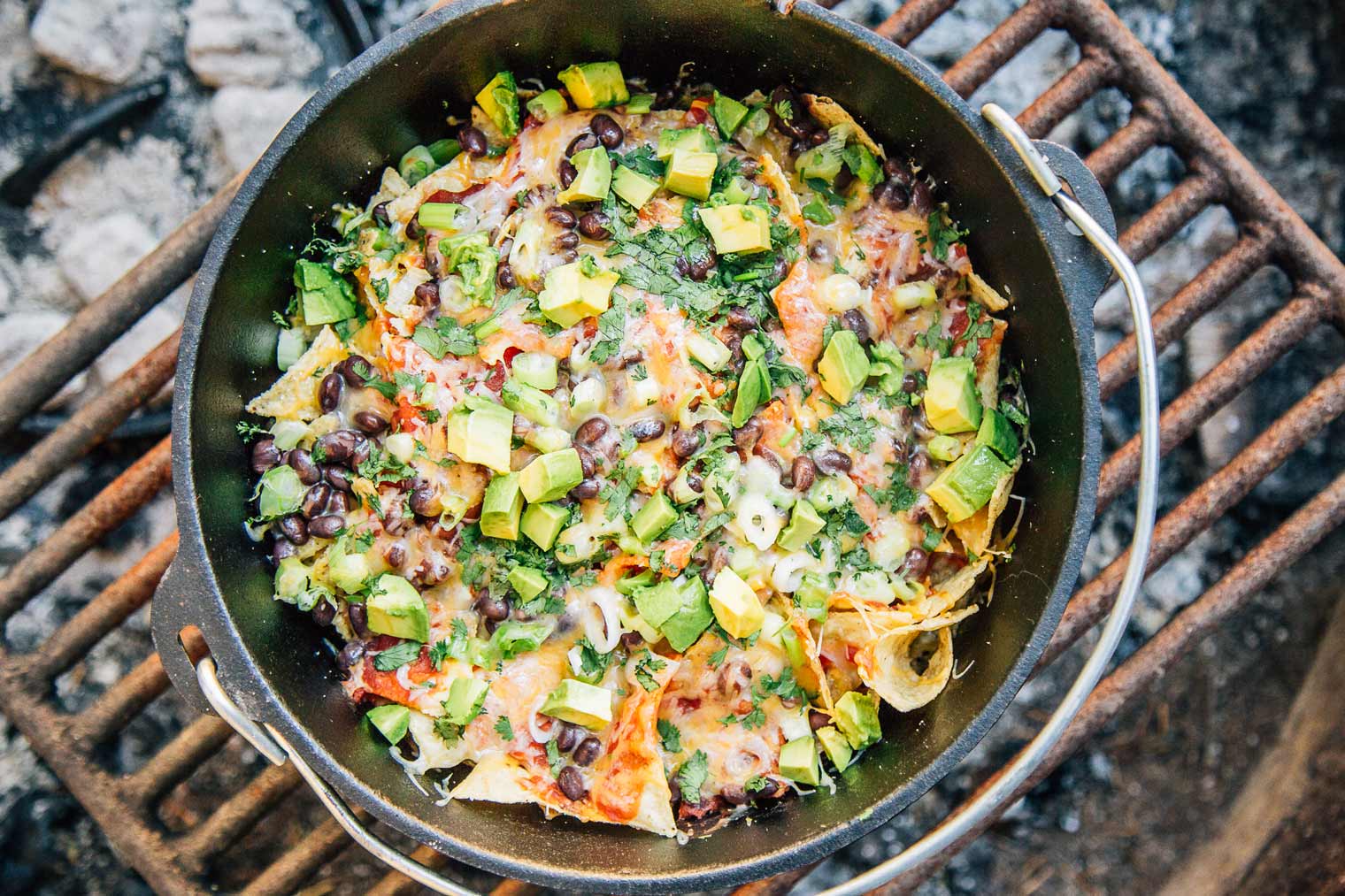 Nachos in a Dutch oven on a campfire grill