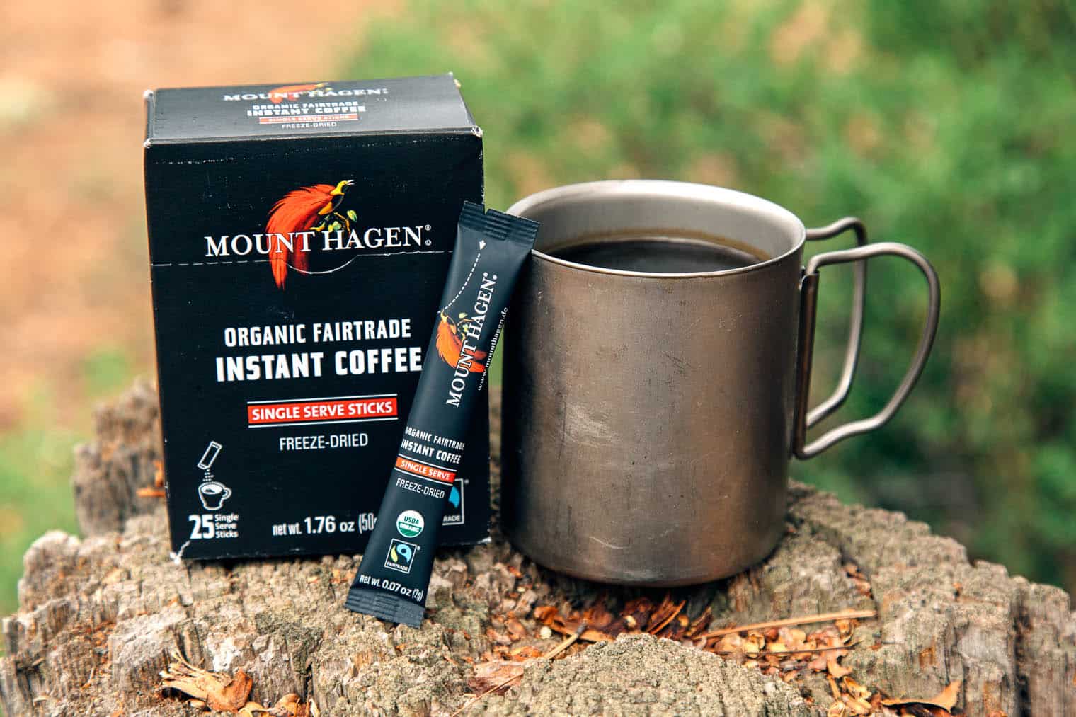 Mount Hagen instant coffee packaging next to a camp mug