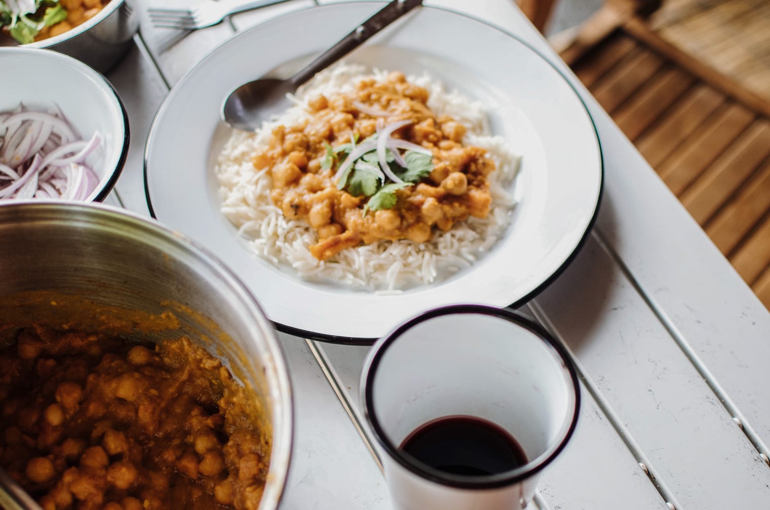 Chana masala on a bed of rice in a bowl