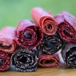Fruit leathers rolled up and stacked in a pile