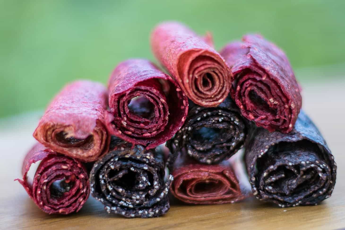 Fruit leathers rolled up and stacked in a pile