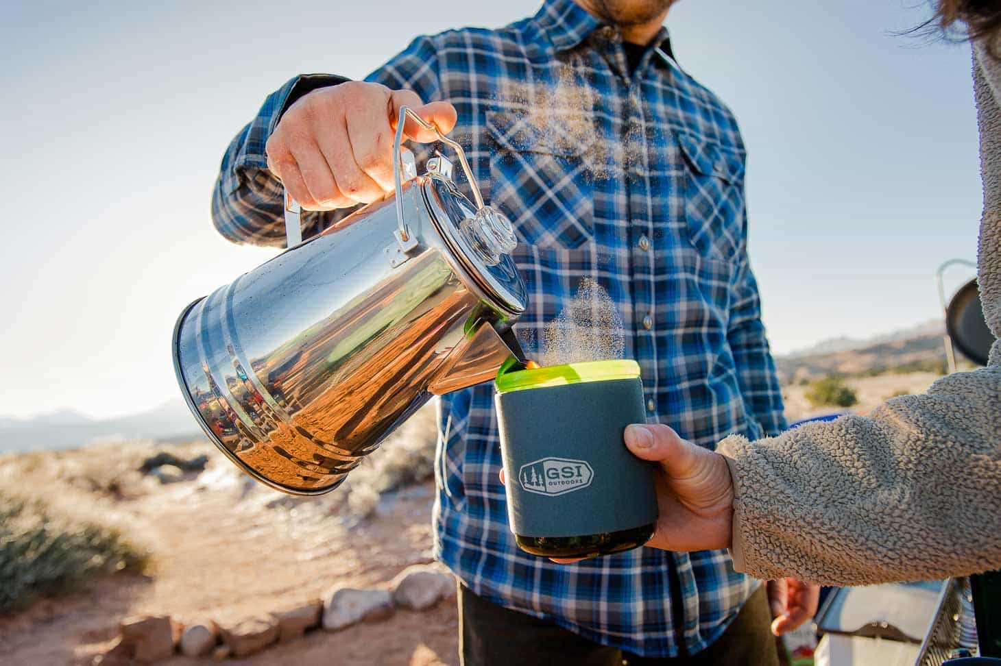 Man pouring coffee from a Camp Percolator