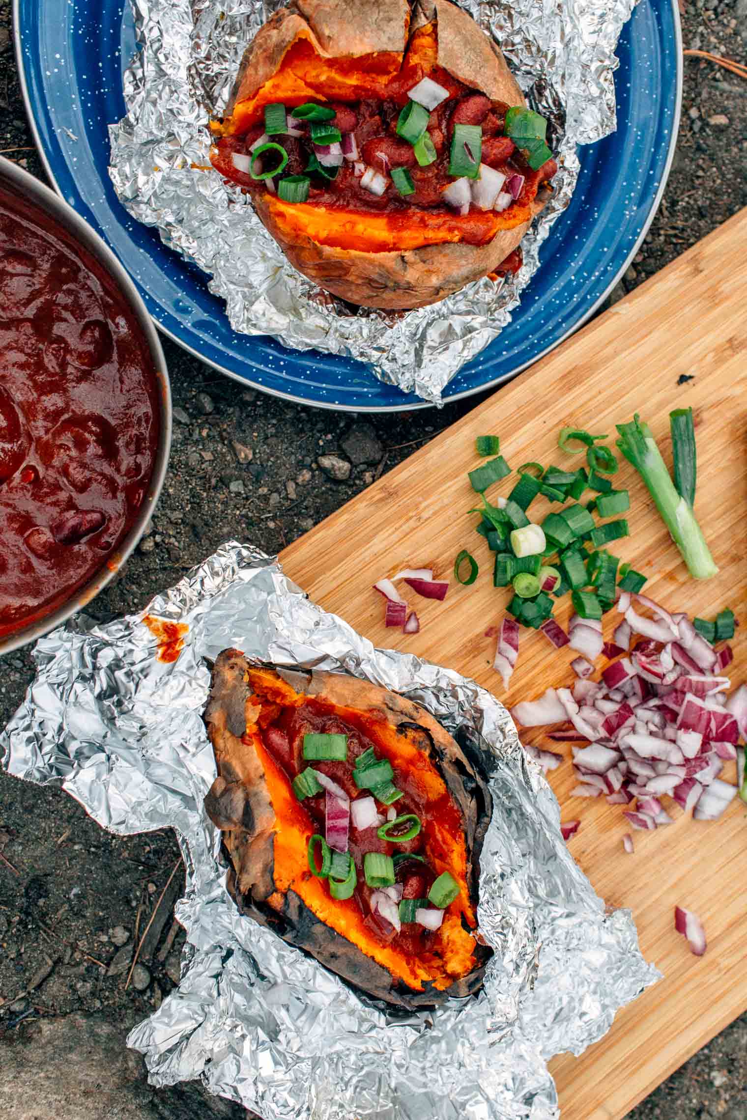 A hearty meal perfect for fall camping trips, this chili stuffed baked sweet potato recipe is easy to make around the campfire.