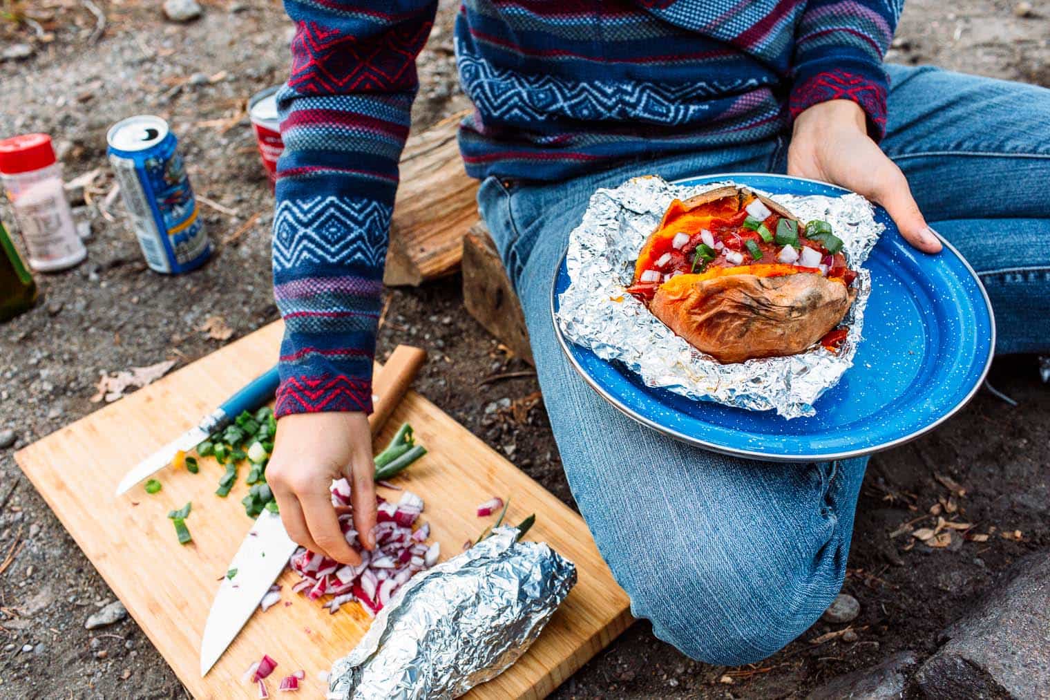 A hearty meal perfect for fall camping trips, this chili stuffed baked sweet potato recipe is easy to make around the campfire.