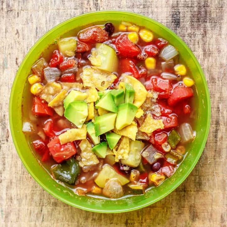 Tortilla soup in a green camp bowl