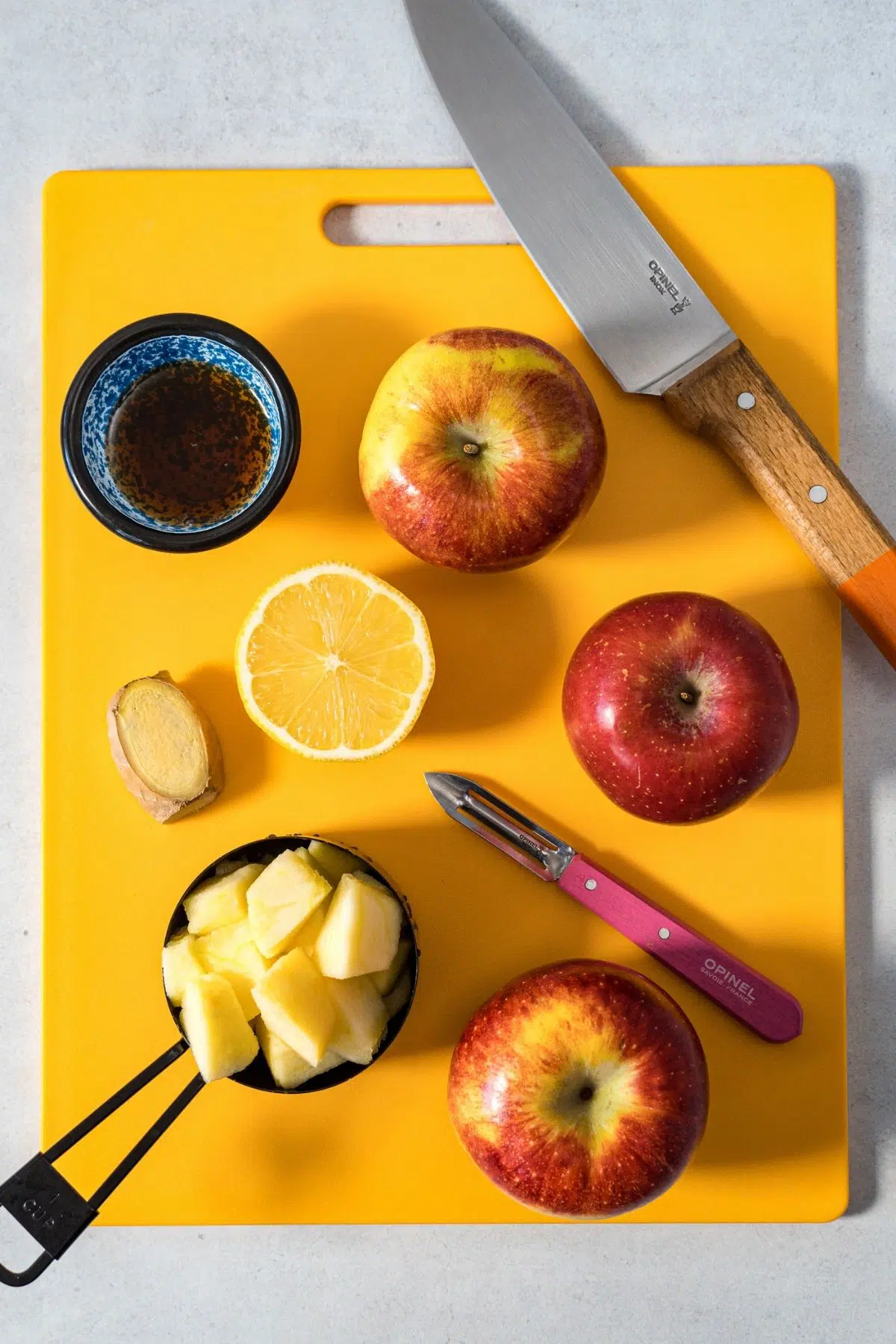 Ingredients for fruit leathers on a yellow cutting board