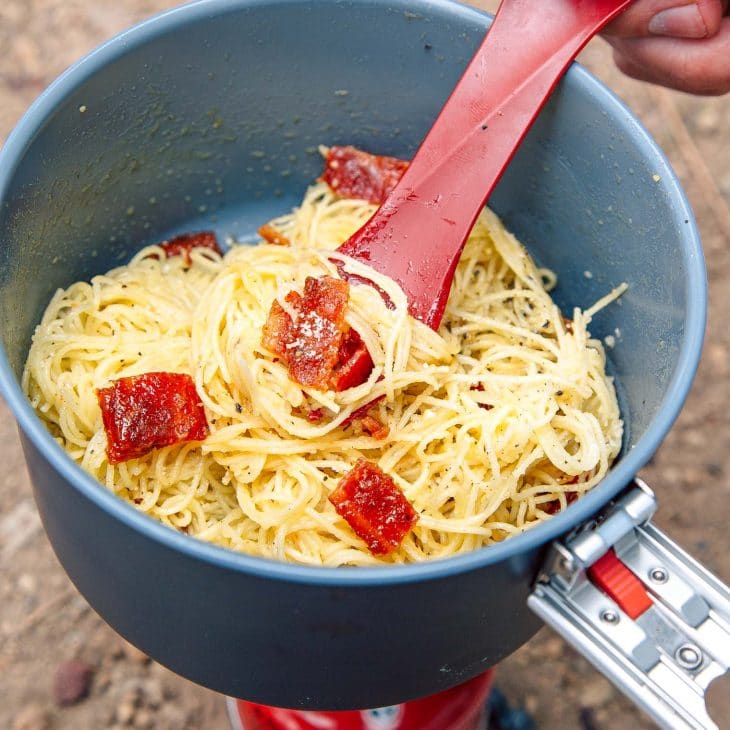 Angel hair pasta and bacon jerky in a backpacking pot