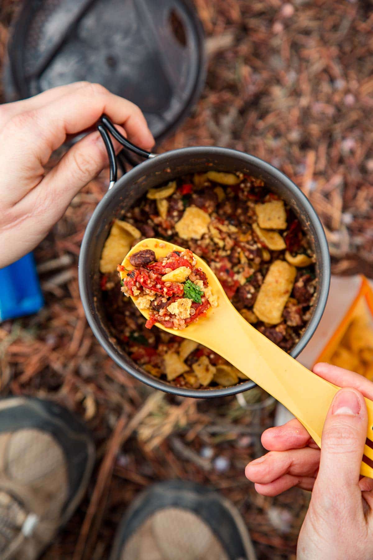 A backpacking pot filled with a burrito bowl backpacking meal