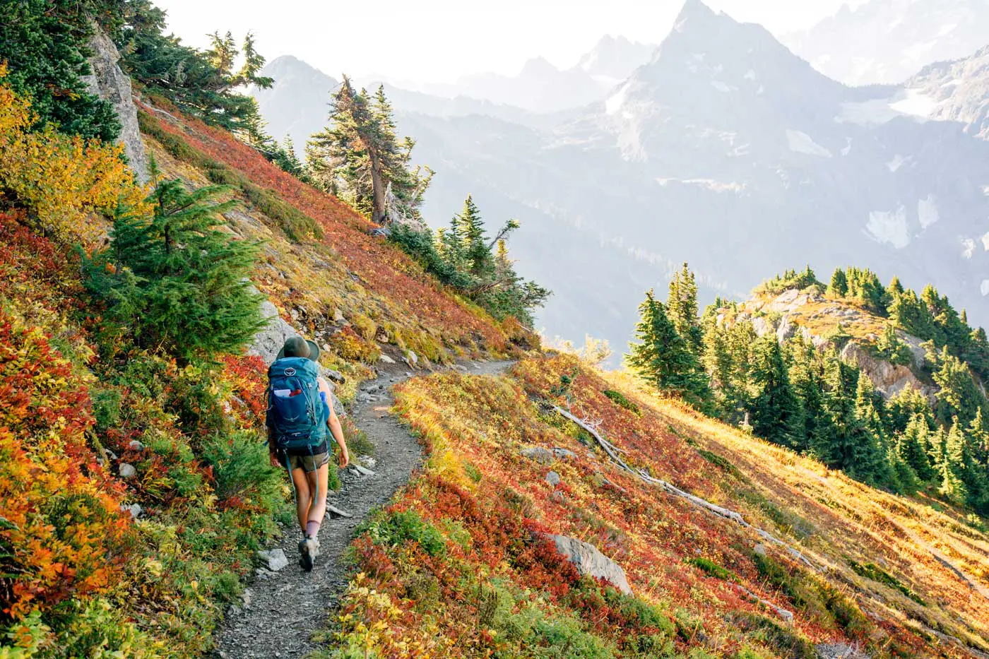 Woman hiking in the Cascade Mountains with fall foliage