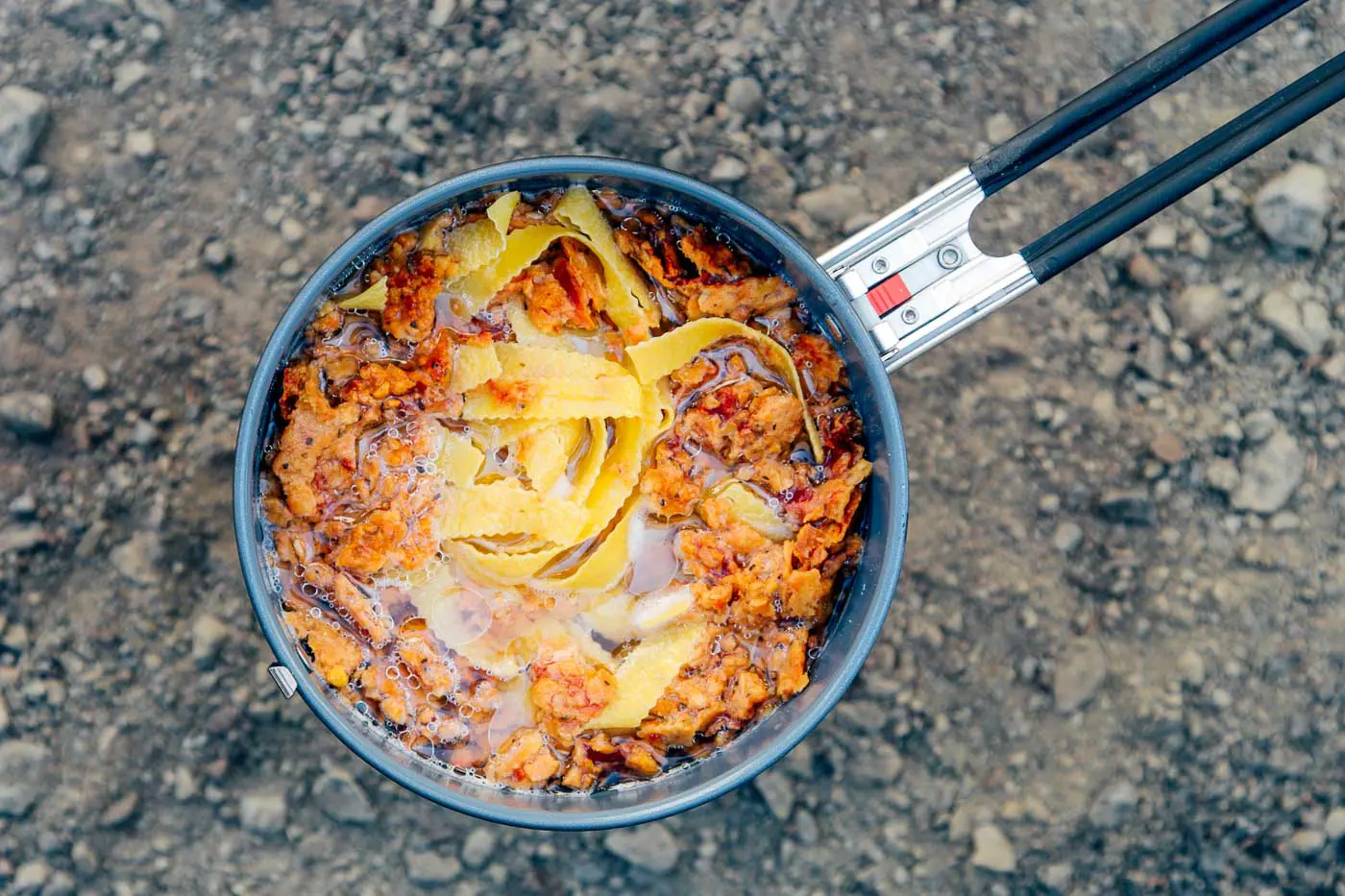 Red lentil marinara and pasta in a backpacking pot