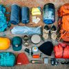 Overhead view of backpacking gear laid out on the floor.