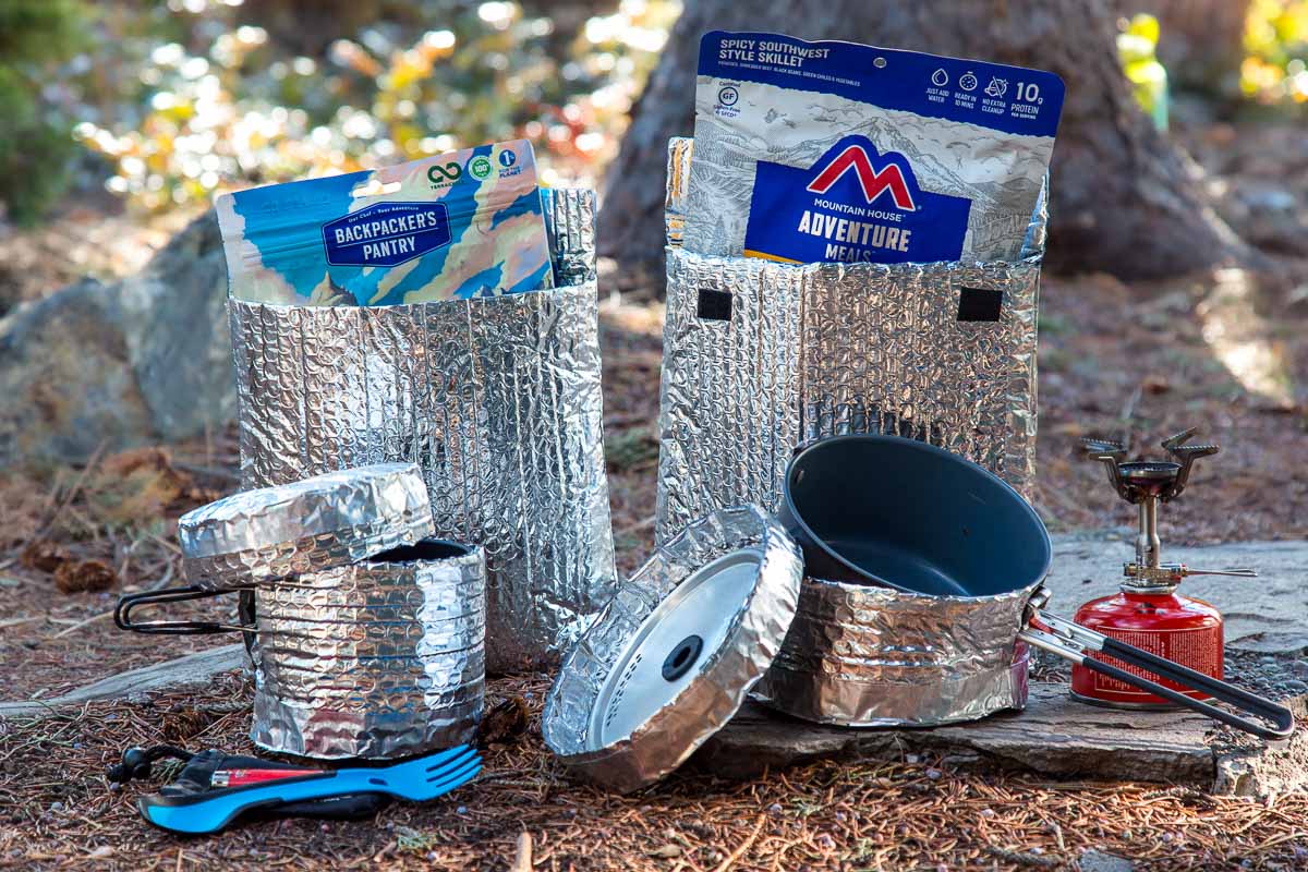 A variety of pots and backpacking pot cozy options