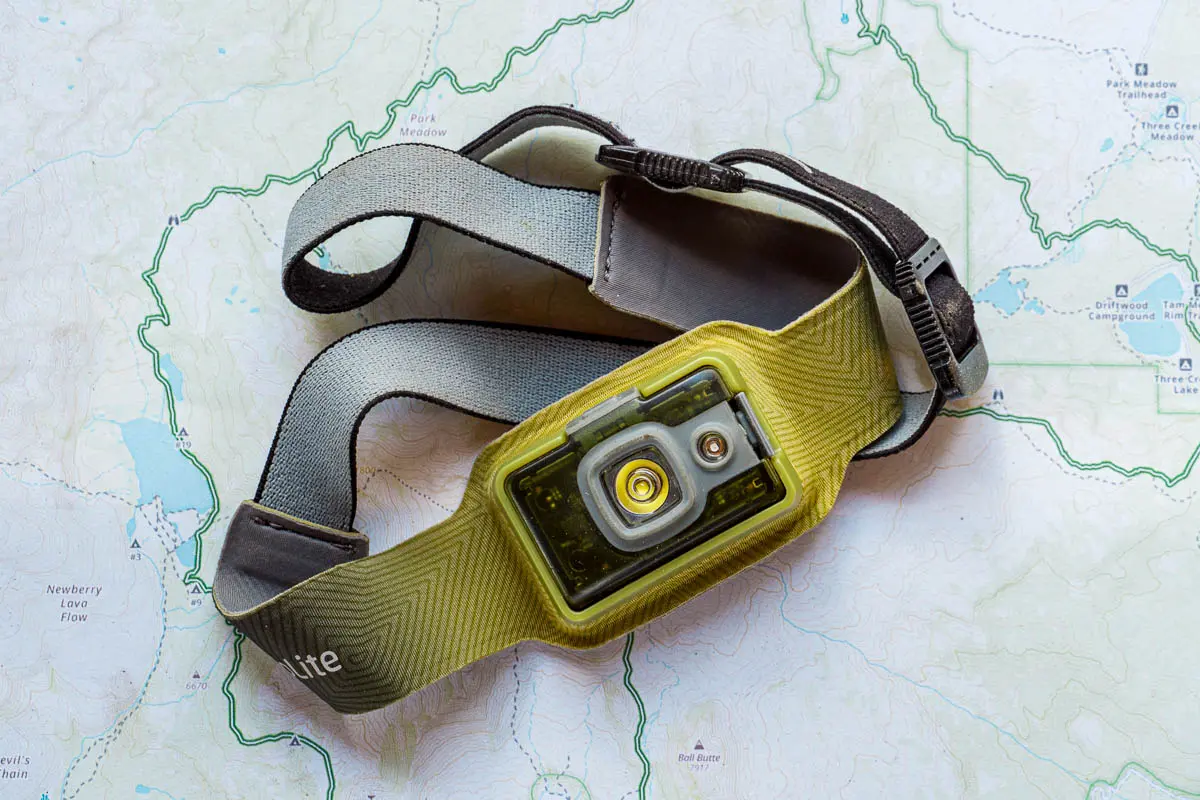 A green headlamp displayed on a trail map