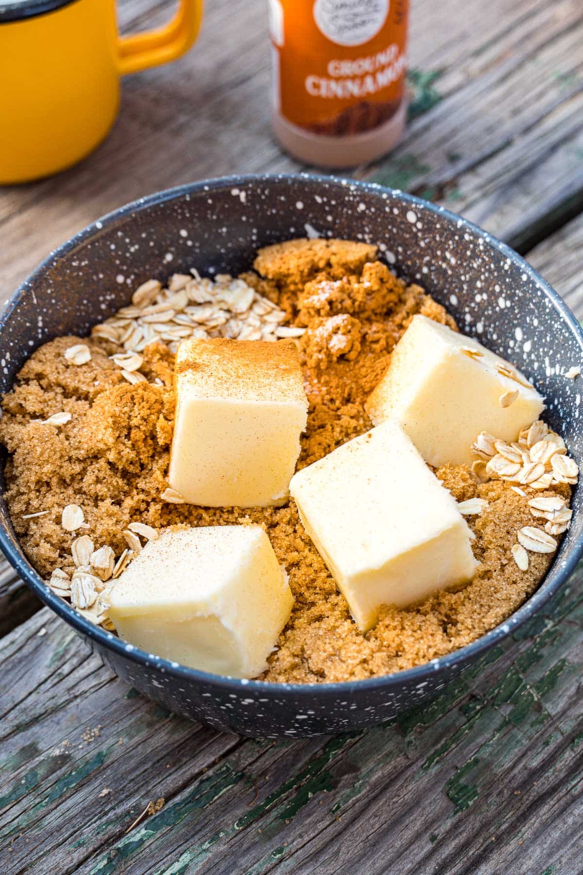 Cubes of butter in a bowl of oats.