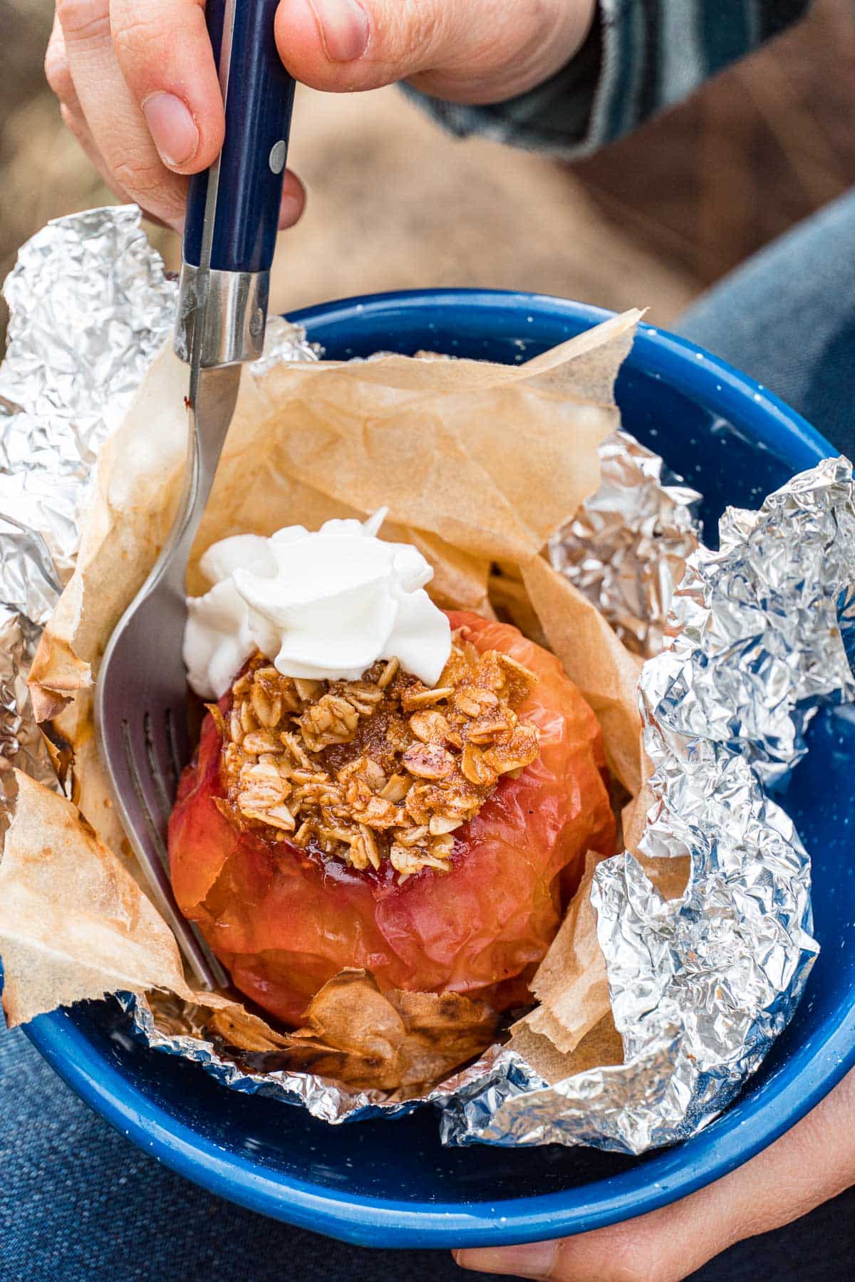 A baked apple in a blue bowl