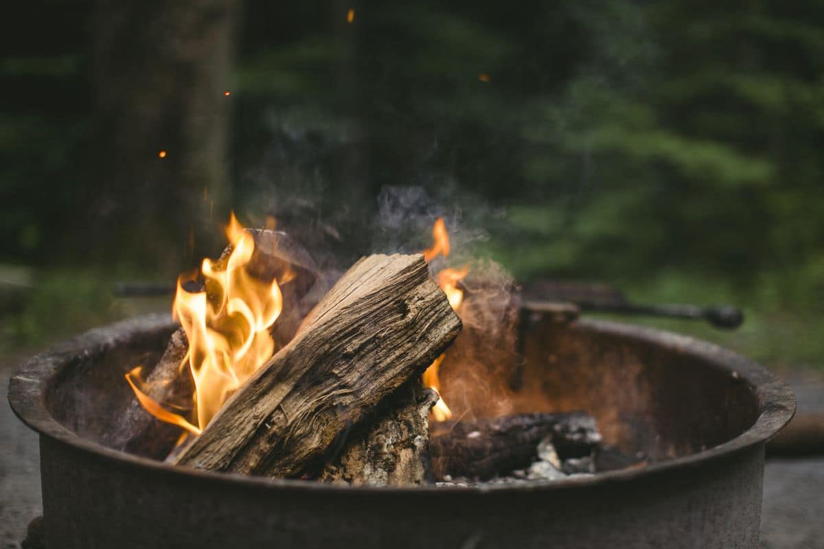 A campfire ring with a small fire