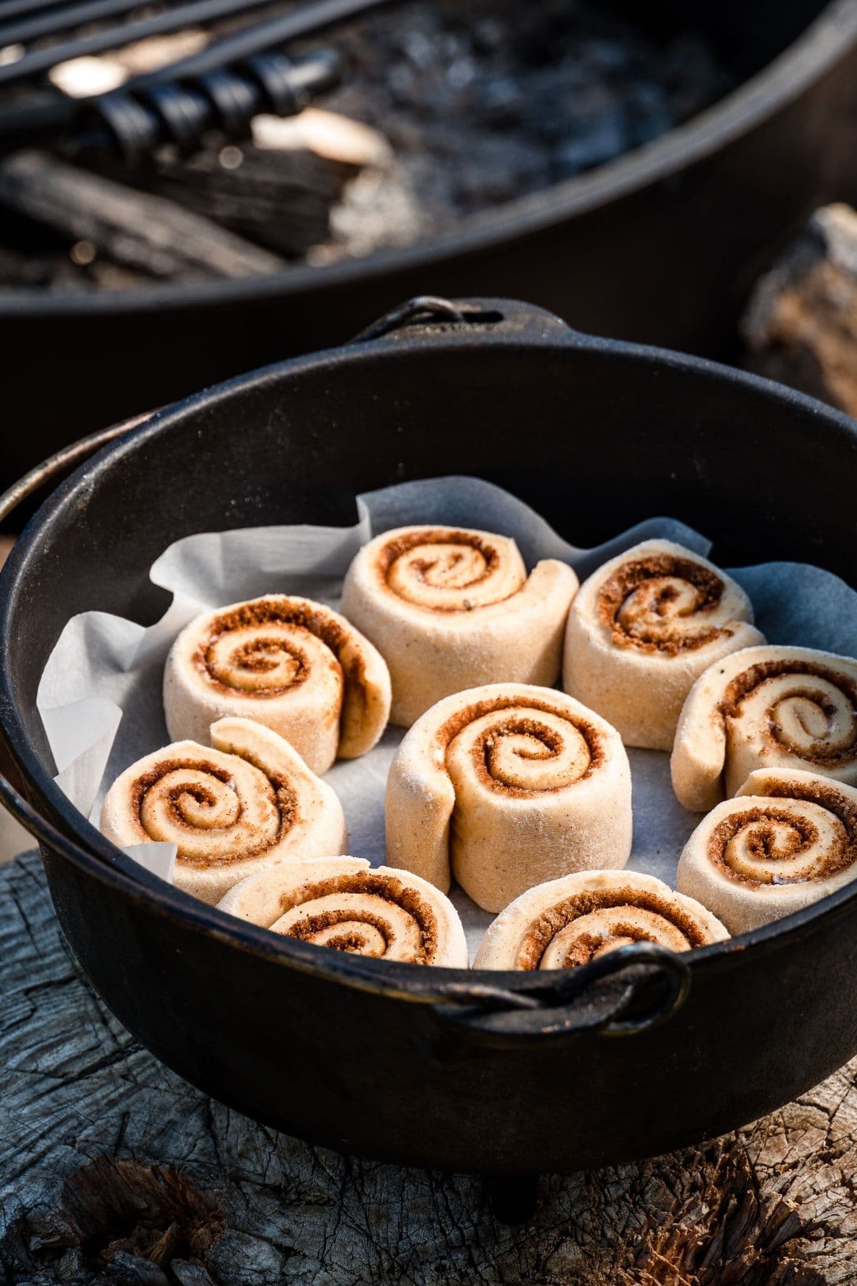 Cinnamon rolls arranged in a lined dutch oven