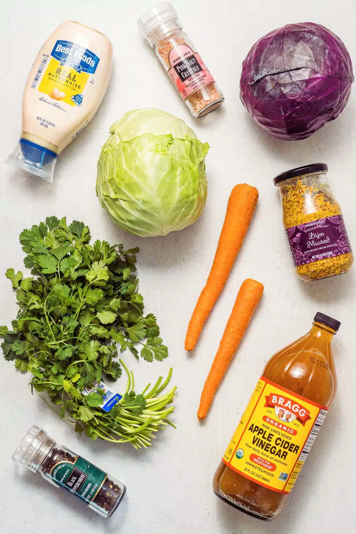 Ingredients for coleslaw displayed on a counter.