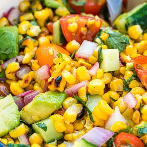 Corn salad with avocado, tomatoes and cucumber
