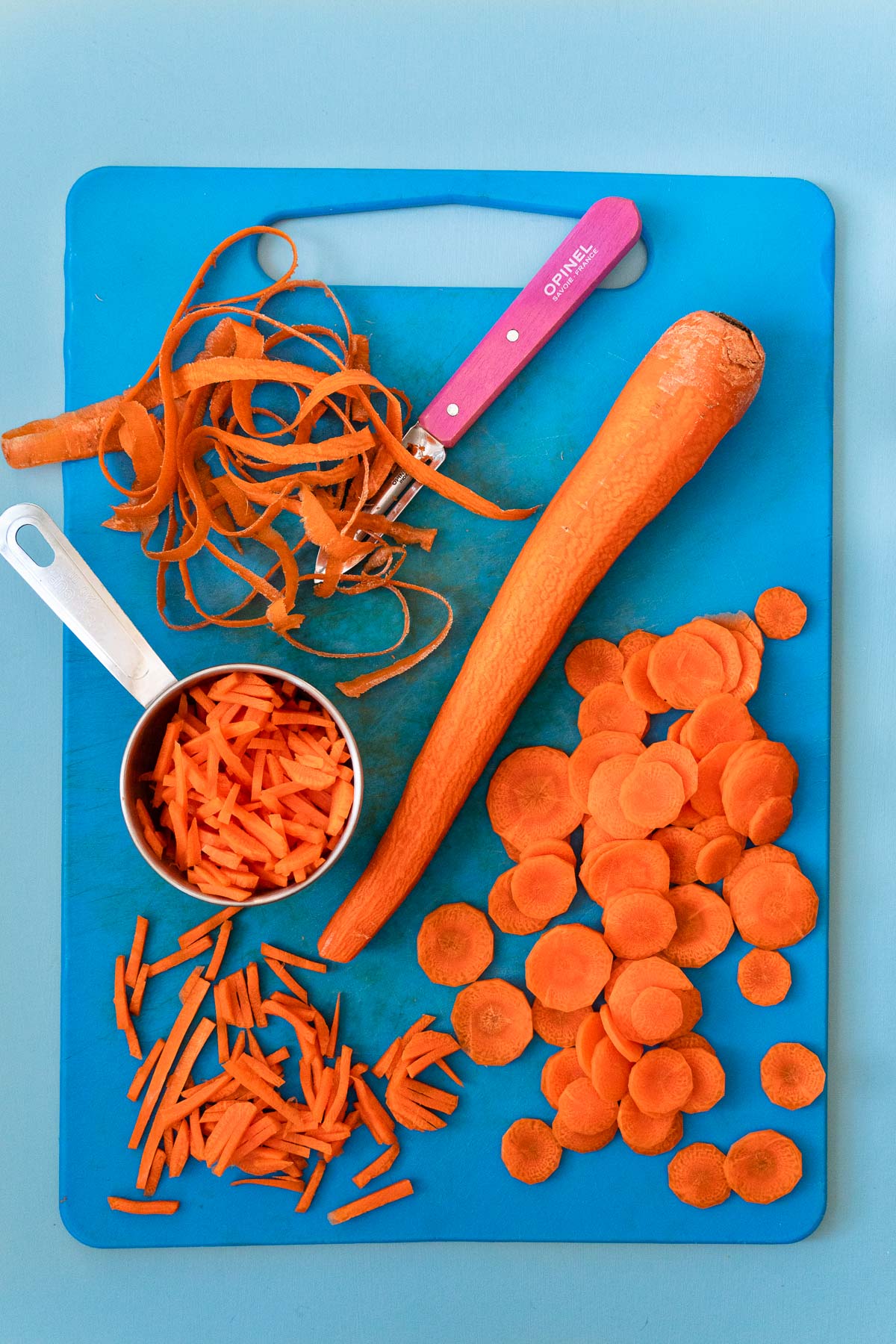 Carrots on a blue cutting board