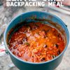 Pinterest graphic with text overlay reading "Dehydrated lentil chili backpacking meal"