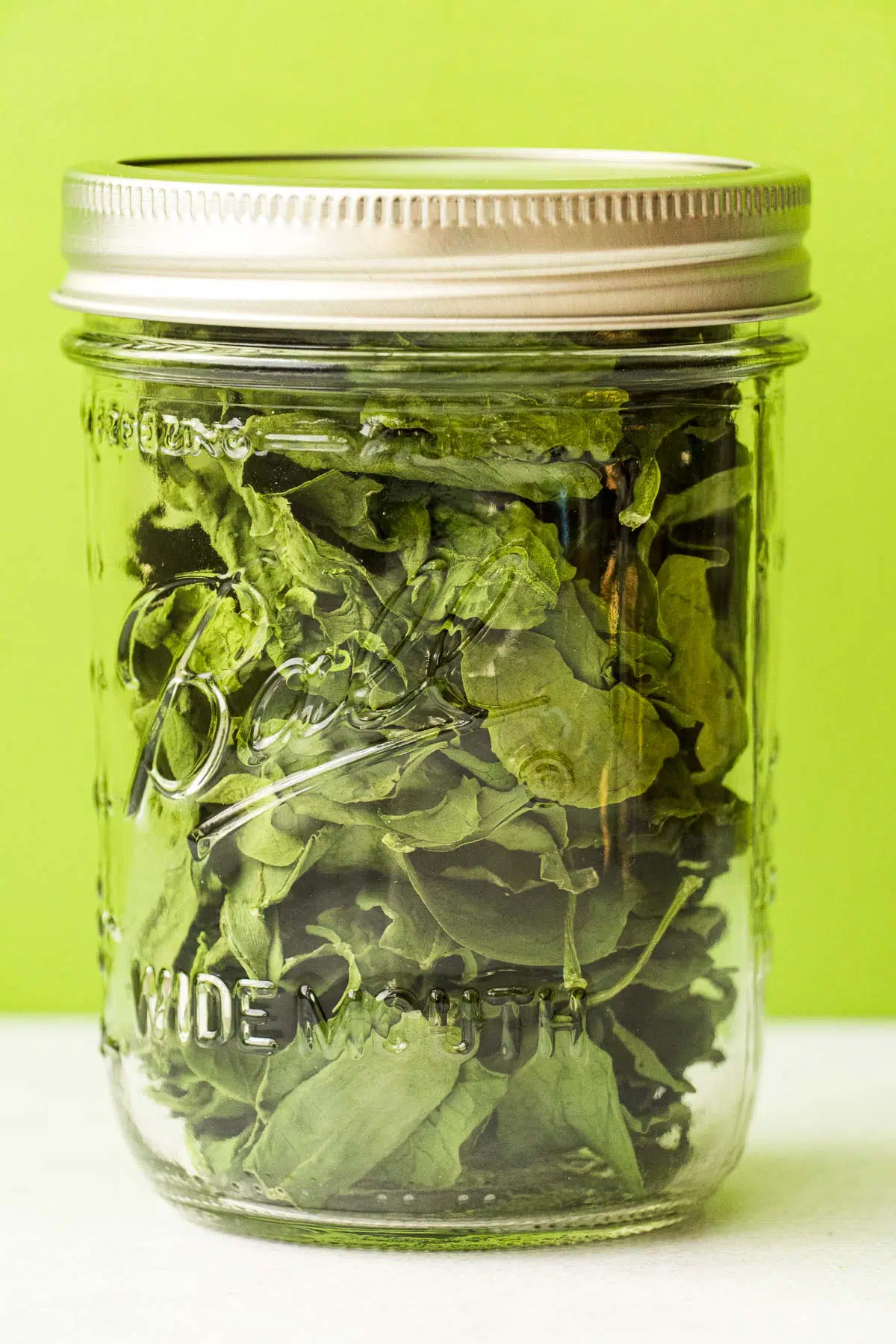 Dried spinach in a glass jar