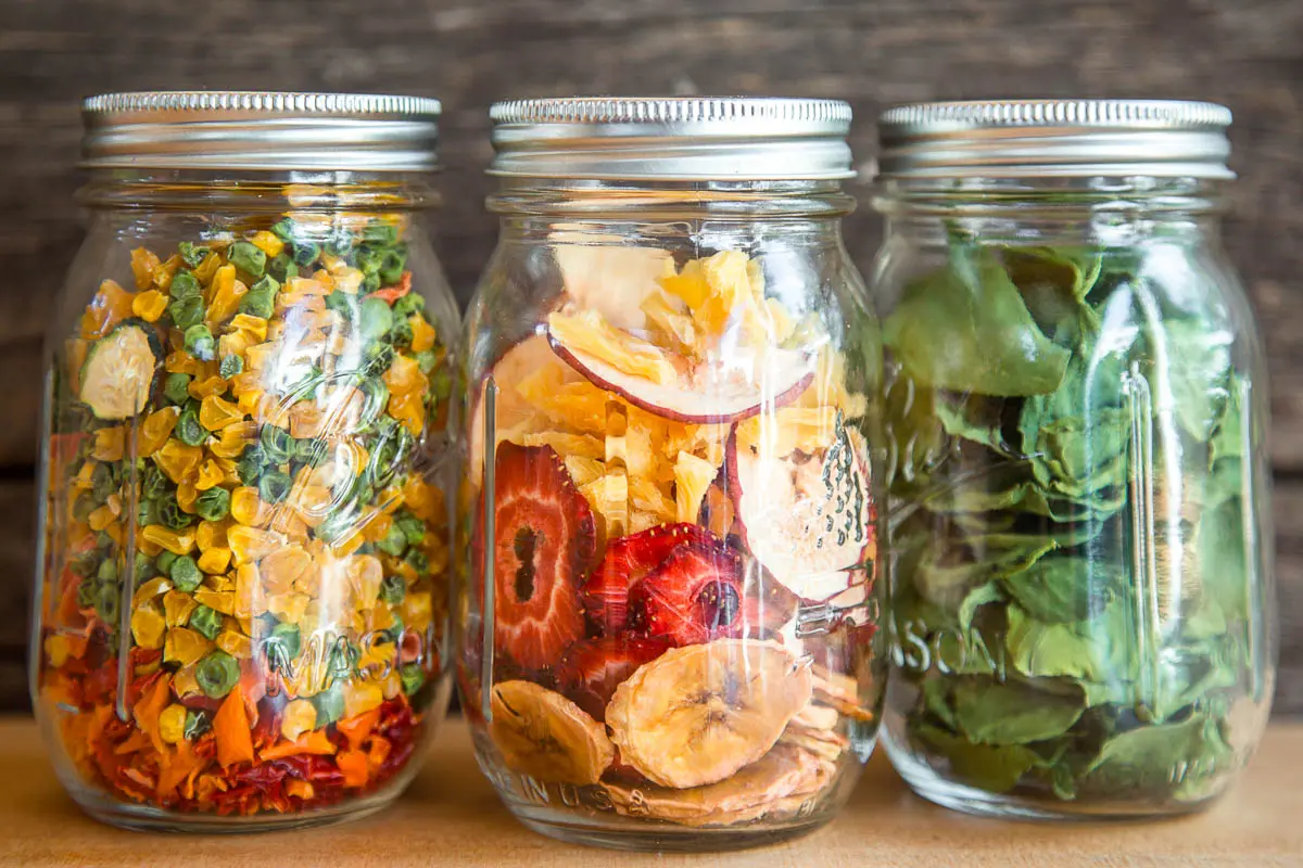Dehydrated fruit and vegetables in three canning jars