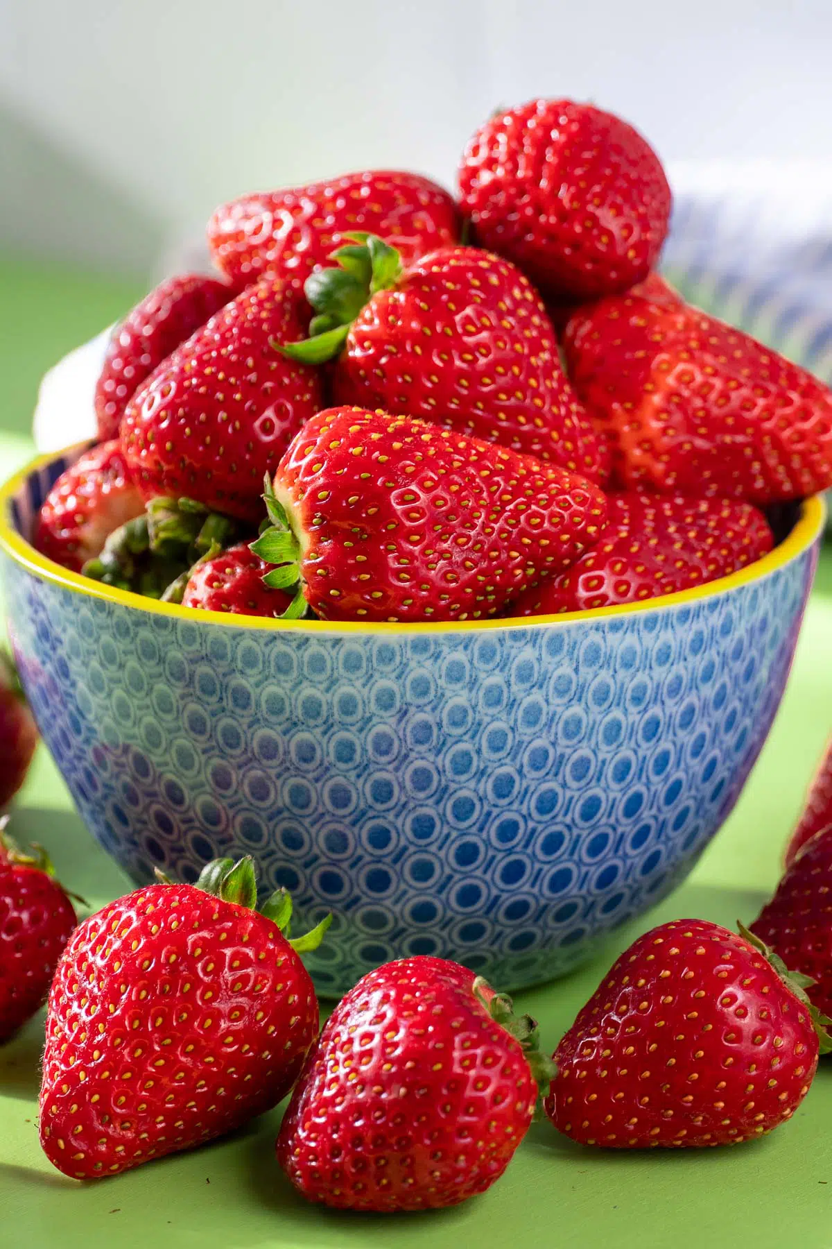 Fresh strawberries in a blue bowl