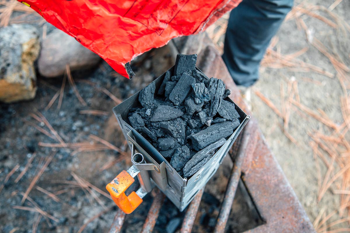 Preparing charcoals in a chimney starter
