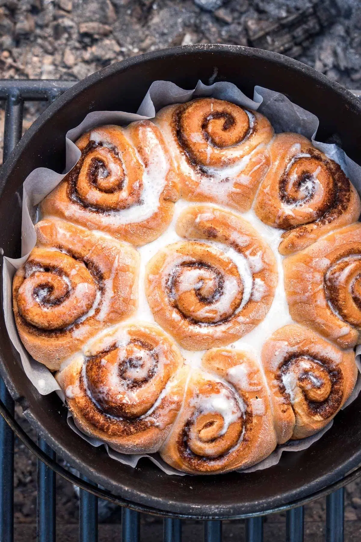 Cinnamon rolls with icing in a Dutch oven