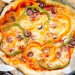 Pizza with cheese, bell peppers, and olives.