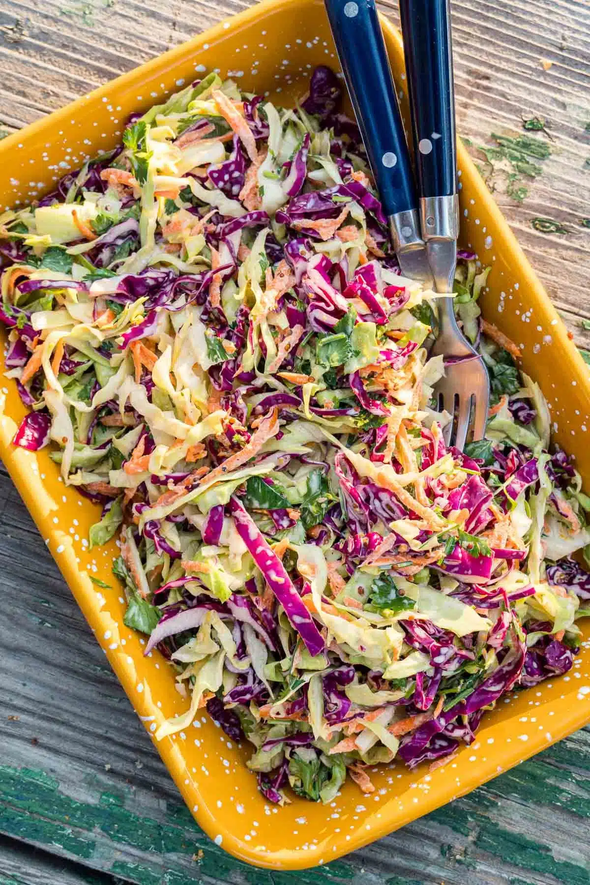 Coleslaw in a yellow dish.