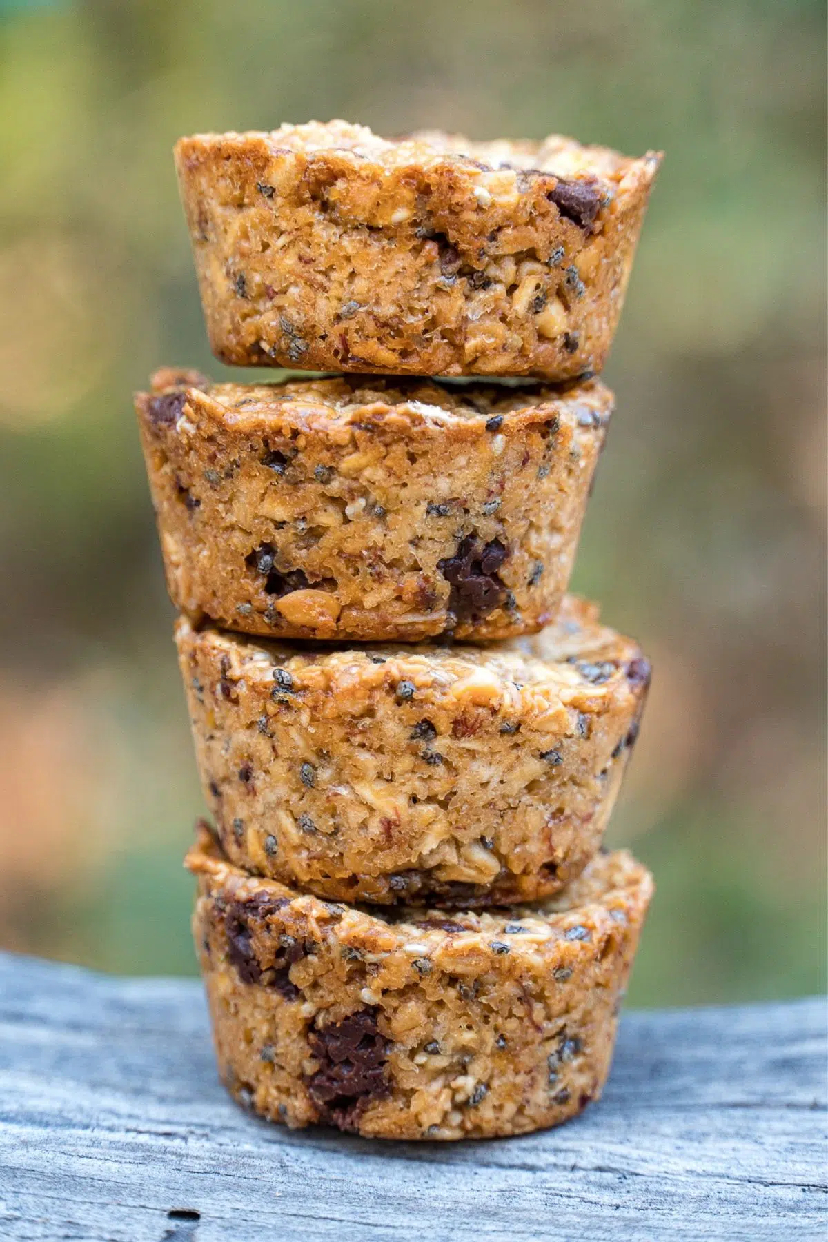 Four granola bites stacked with a natural background