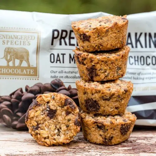 Granola bites stacked next to a package of Endangered Species Chocolate Chips