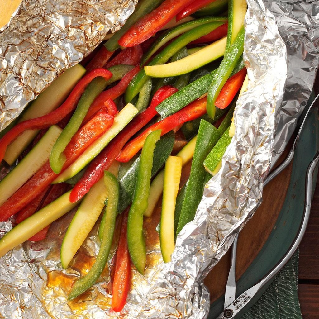 Strips of bell peppers and zucchini in foil.