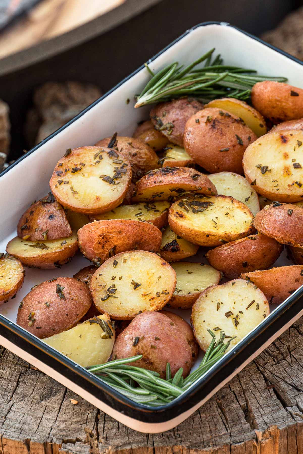 Grilled potatoes in a white baking dish