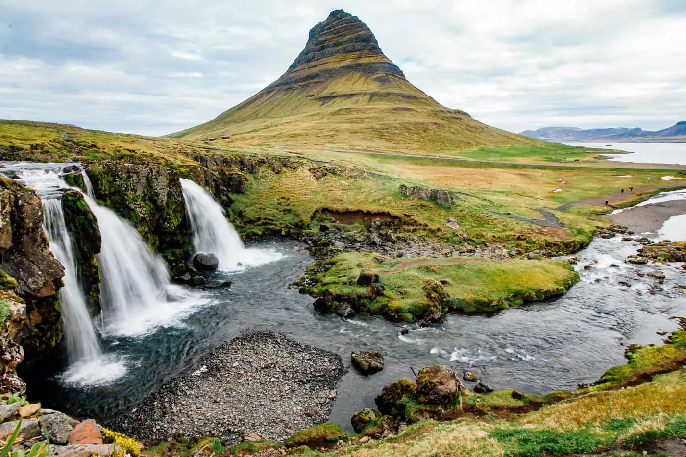 The three Kirkjufellsfoss waterfalls with the Kirkjufell mountain in the background