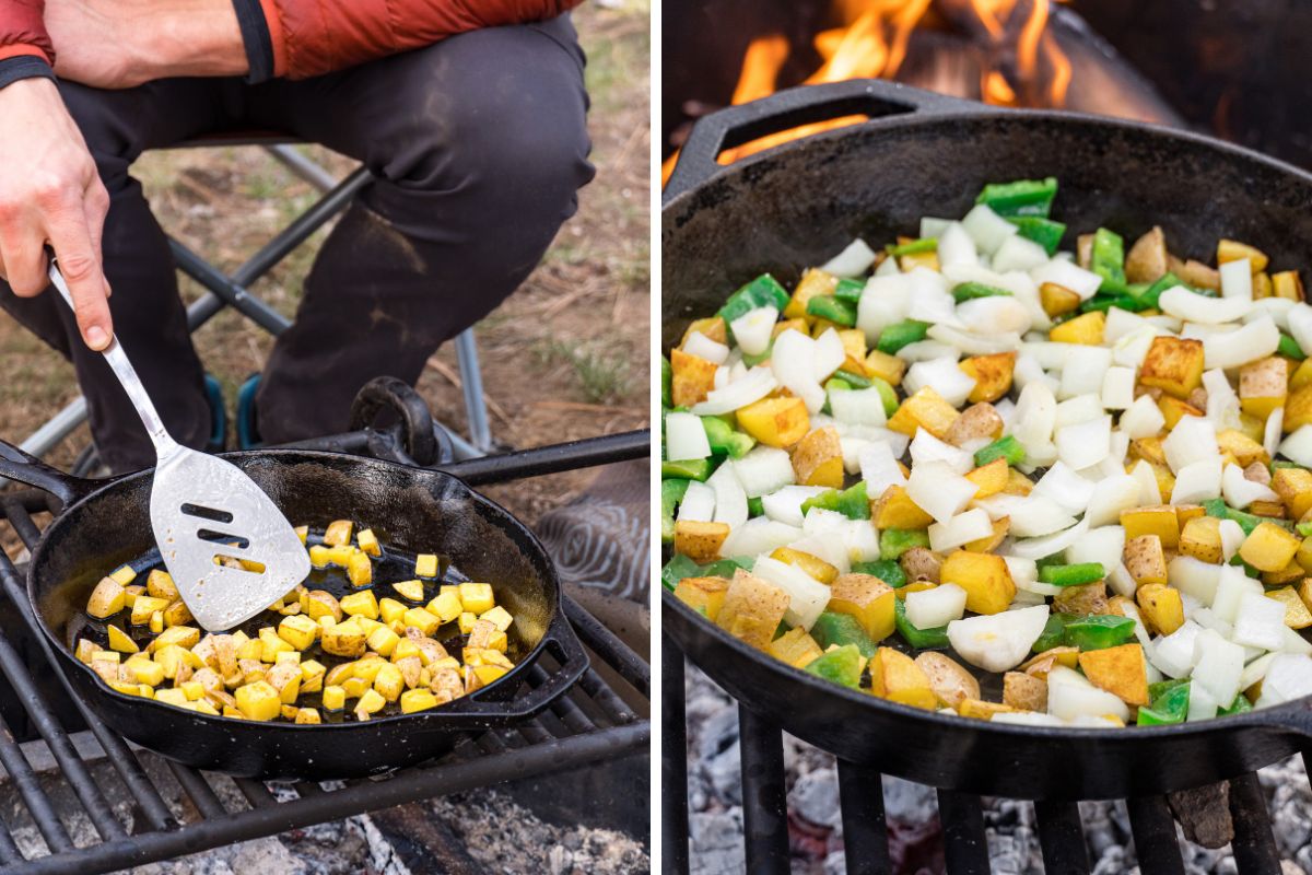 Cooking potatoes onions and peppers in a skillet over a campfire