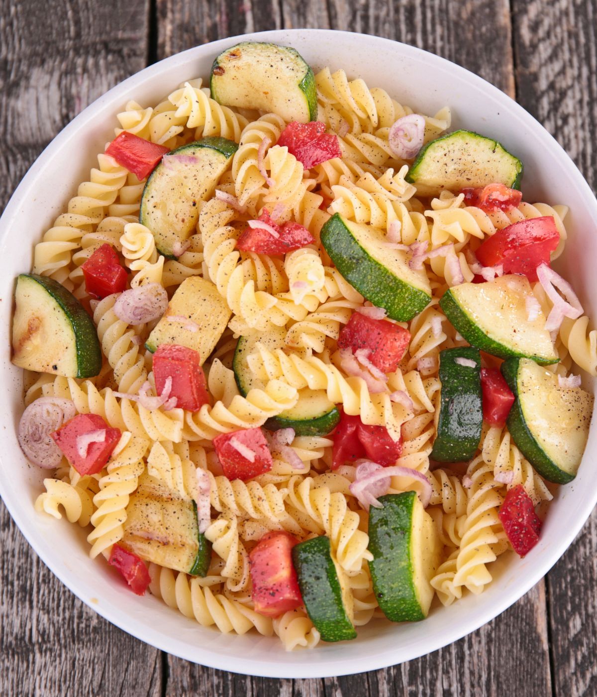 Pasta salad with veggies in a bowl.
