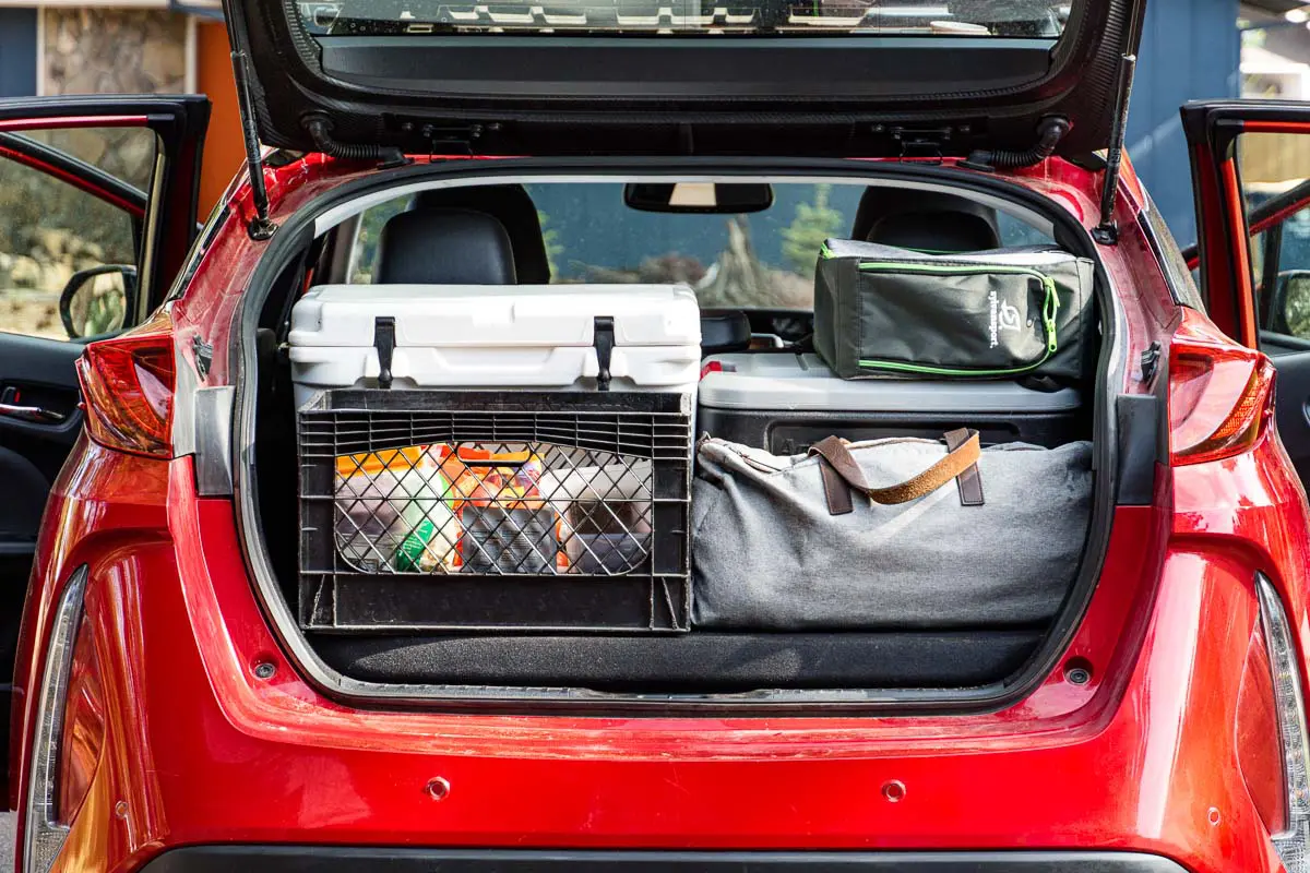 The trunk of a car organized with road trip essentials