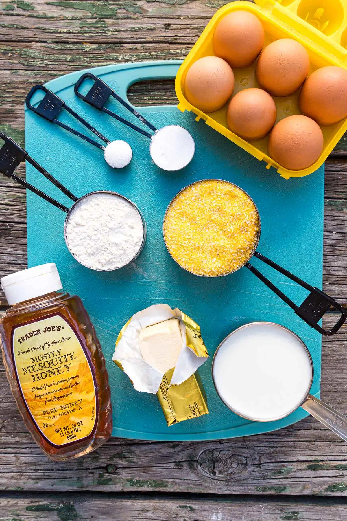 Ingredients for cornbread on a blue cutting board