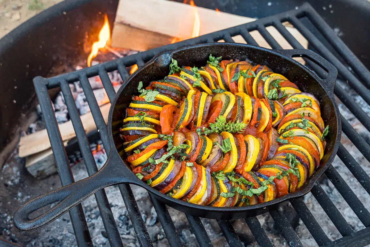 Ratatouille in a skillet over a campfire
