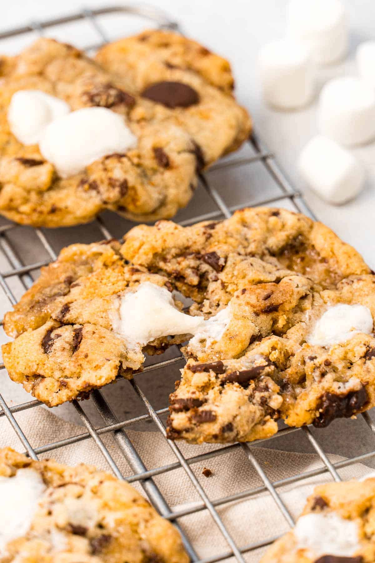 A close-up of s’mores cookies on a wire rack.