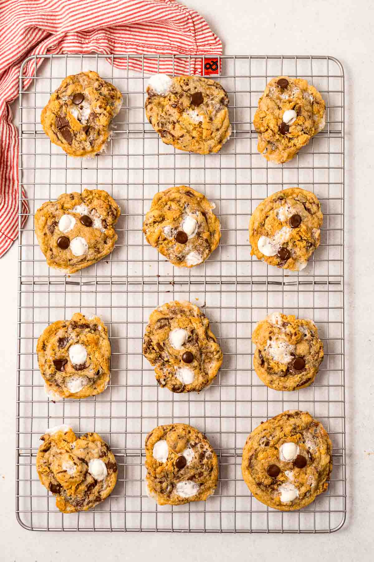 Baked s’mores cookies cool on a wire rack. 