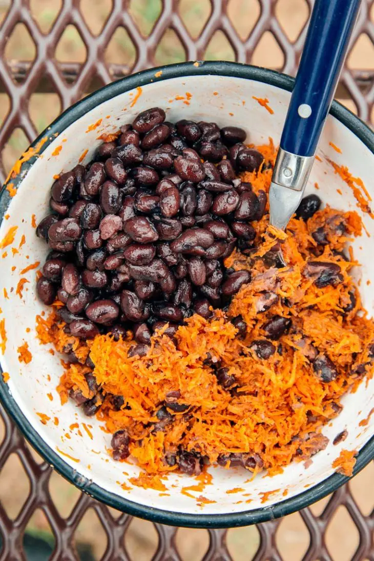 Black beans and shredded sweet potatoes in a bowl.