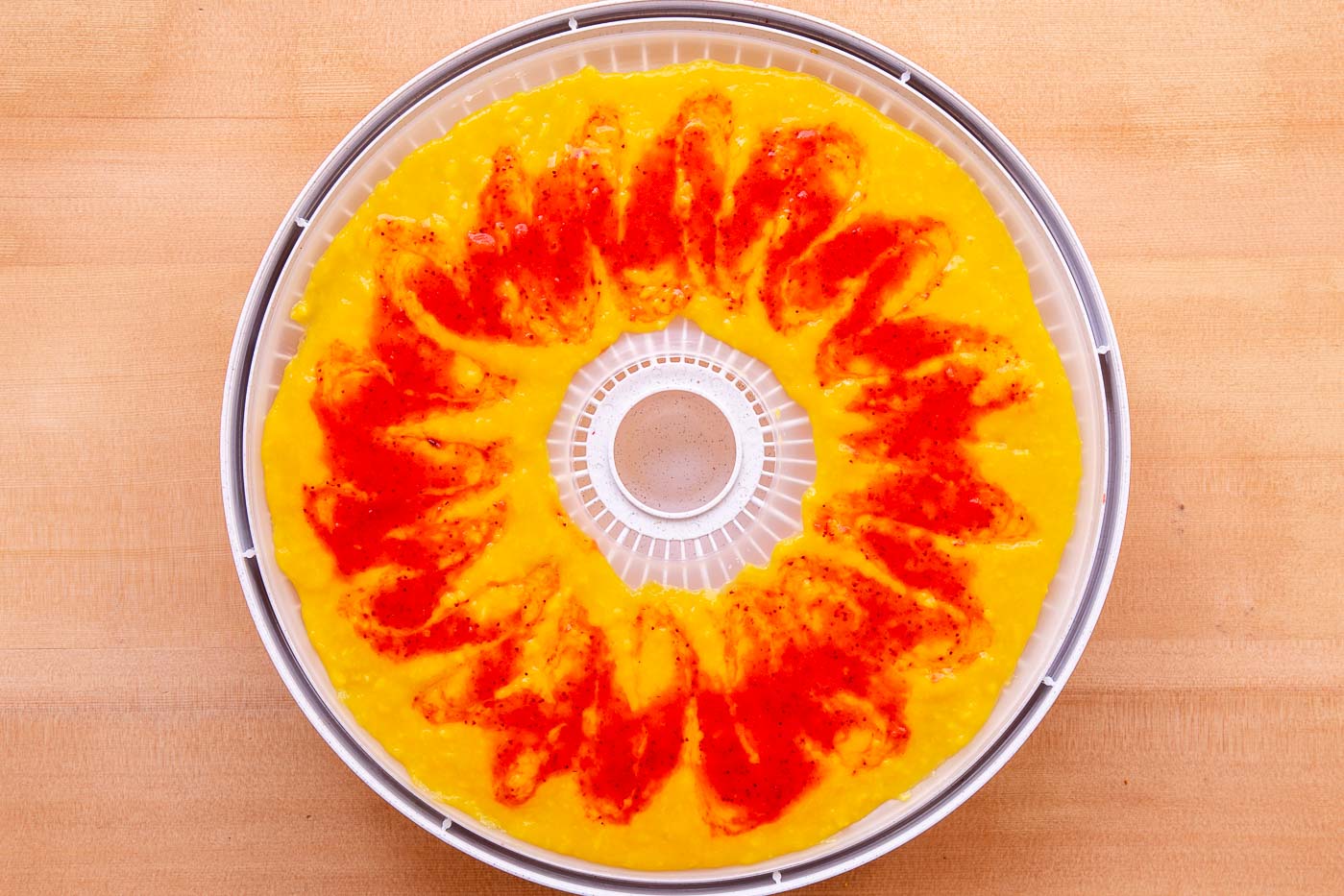 Dehydrator tray loaded with fruit puree